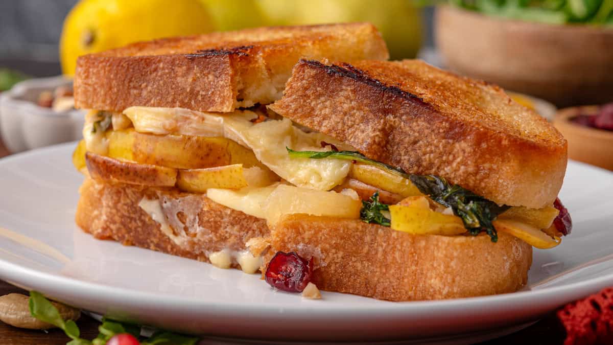 Pear & Brie: Your New Favorite Grilled Cheese for Summer and Fall Pear & Brie Grilled Cheese Sandwich on a white plate.