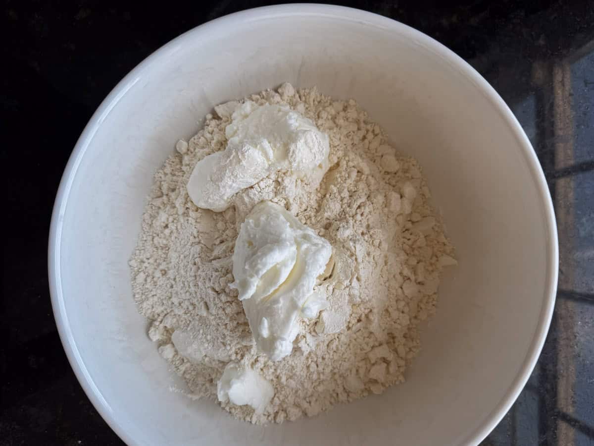 How to make pecan pie crust Mixing pie crust ingredients in a bowl.