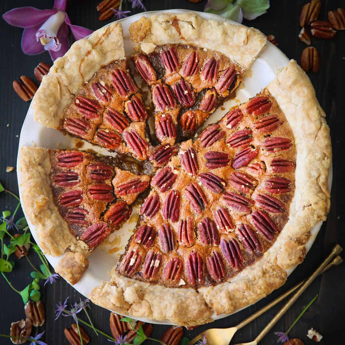 Pecan Pie in a white pie dish.