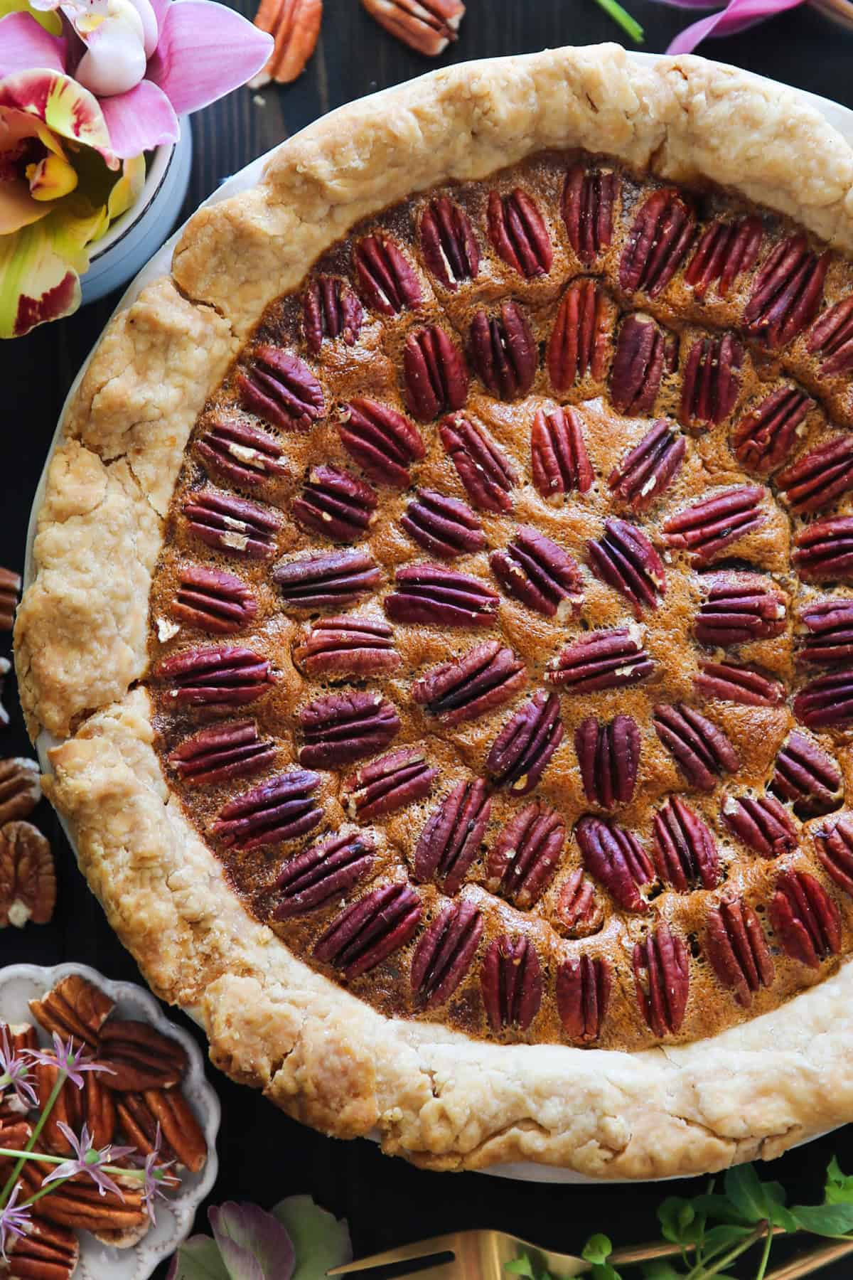 Classic Homemade Pecan Pie Pecan Pie in a white pie dish.