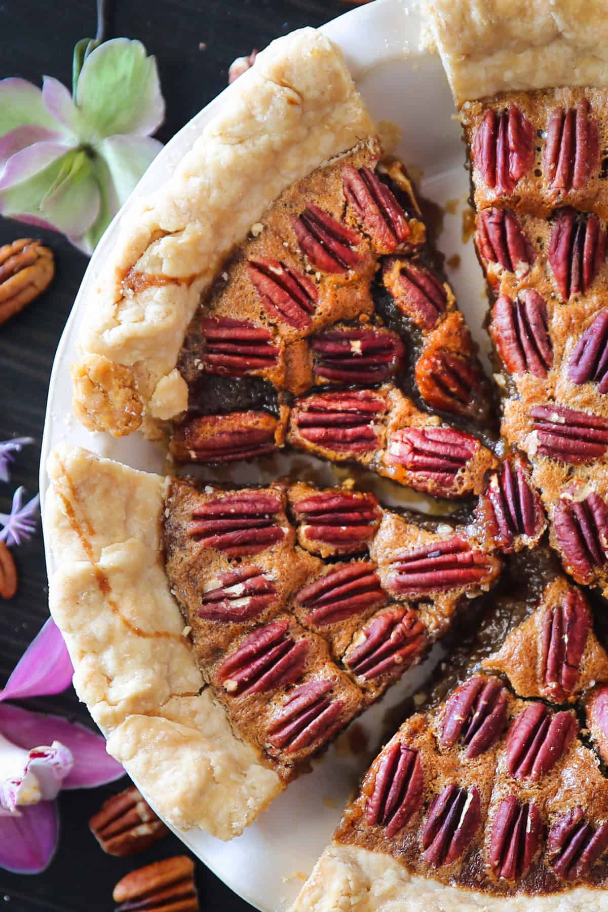 Classic Homemade Pecan Pie Pecan Pie in a white pie dish.