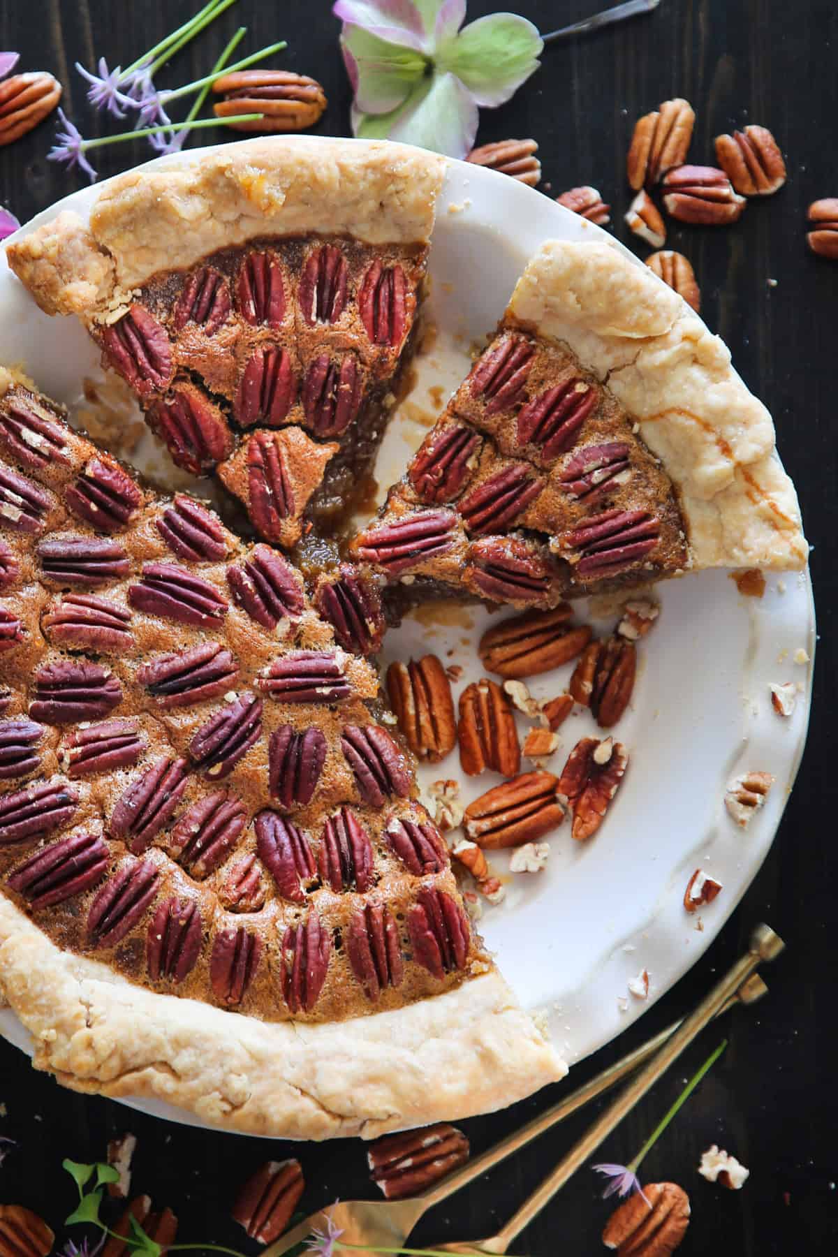 Classic Homemade Pecan Pie Pecan Pie in a white pie dish.