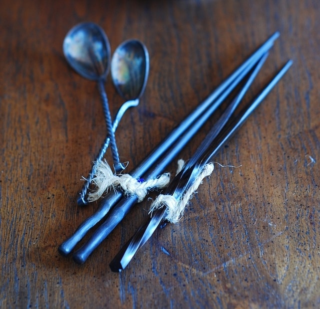 chopsticks and spoons on a table
