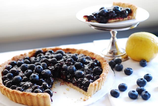Blueberry Tart on a plate on a table