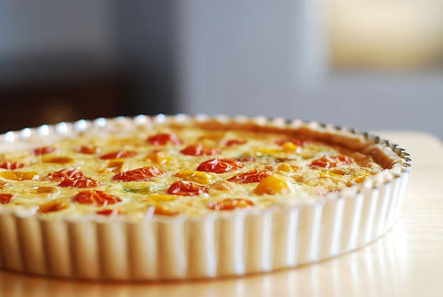 Egg and Cheese Breakfast Tart with Grape tomatoes, thyme