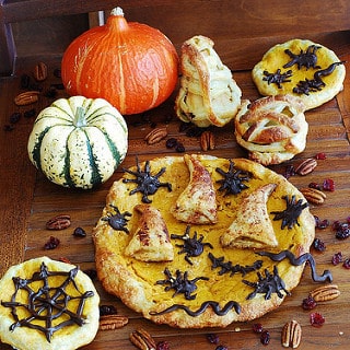 Pumpkin tart with apple-cranberry stuffed crust, chocolate bugs and wizard hats
