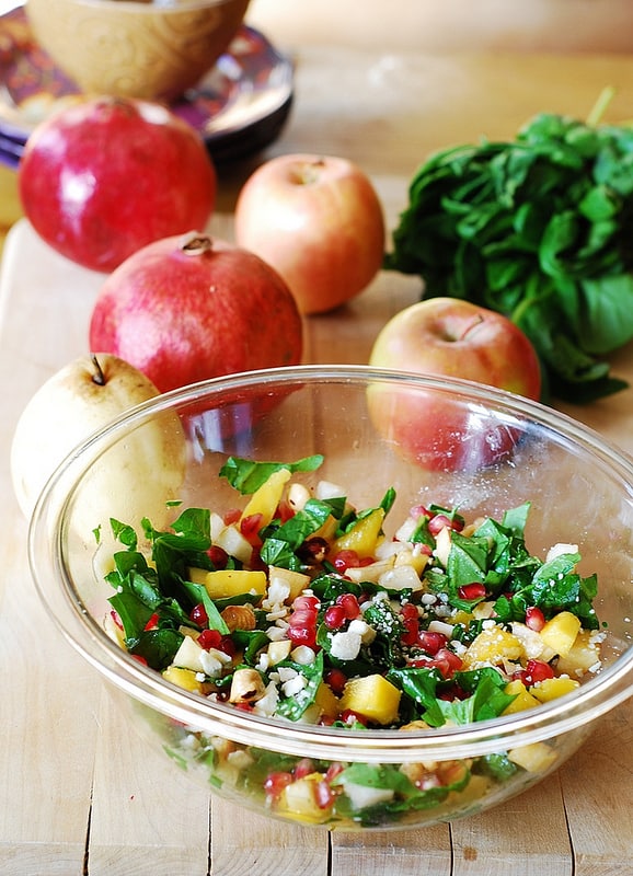 Chopped salad with fruit, pomegranates, nuts, and Gorgonzola cheese