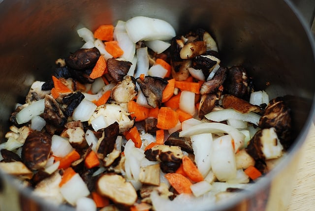 cooking mushrooms, carrots, onions