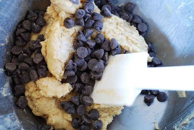 mixing chocolate chips into cookie dough