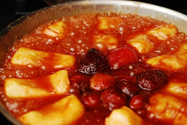 Apple tarte tatin, or caramel apple tart, with strawberries