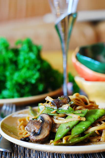 Spicy Asian noodles and mushrooms, with snow peas
