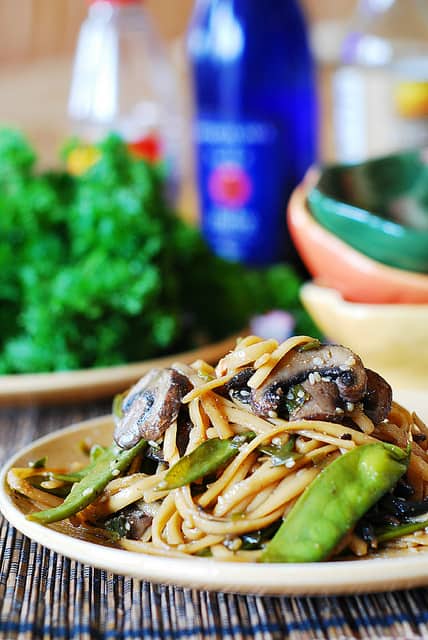 Spicy Asian noodles and mushrooms, with snow peas