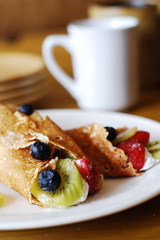 Dessert crepes with ricotta cheese, berries, and kiwi