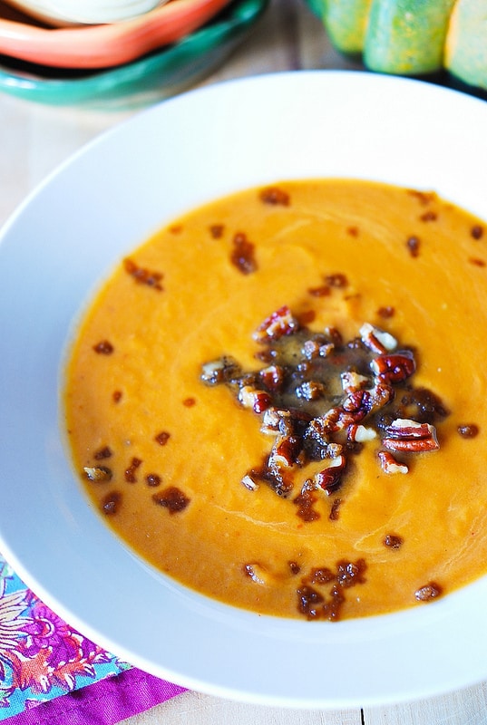 Pumpkin Coconut Soup with red curry paste, cumin, honey, with Caramelized Pecans