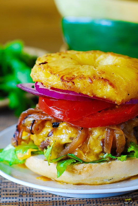 Hamburger with caramelized onions and grilled pineapple