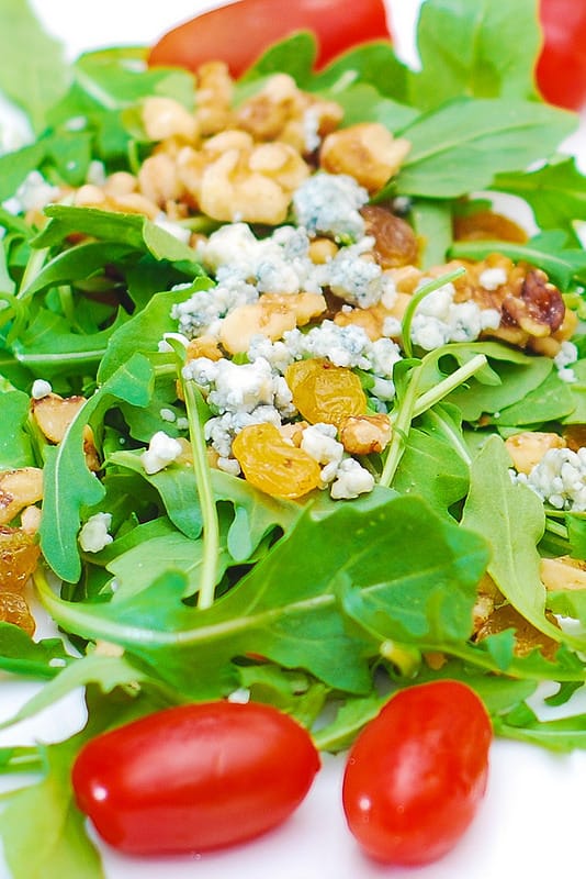 Arugula salad with walnuts, golden raisins, and Gorgonzola cheese