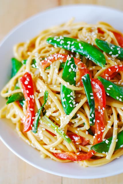 Cold Asian noodle salad with snap peans and red bell peppers