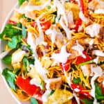 chicken taco salad with spinach, tomatoes and cheddar