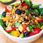 Strawberry Spinach Salad with Mango, Avocado, Blueberries, and Cashew Nuts, with balsamic vinaigrette