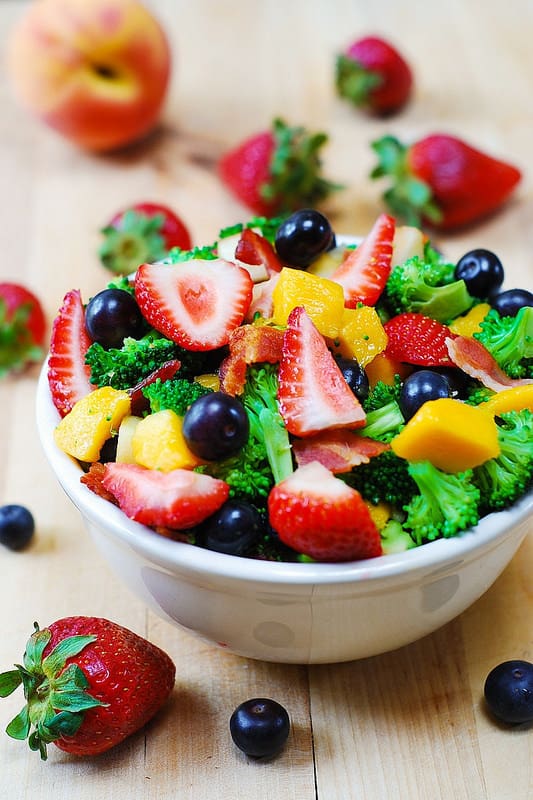 broccoli salad with strawberries, blueberries, mango, bacon