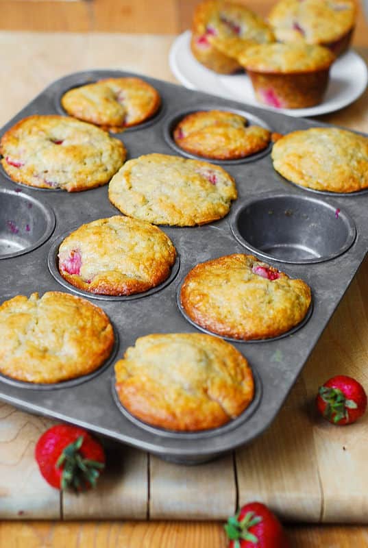 strawberry banana bread muffins in a muffin baking pan