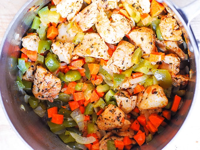 Cook chicken with bell pepper and carrots
