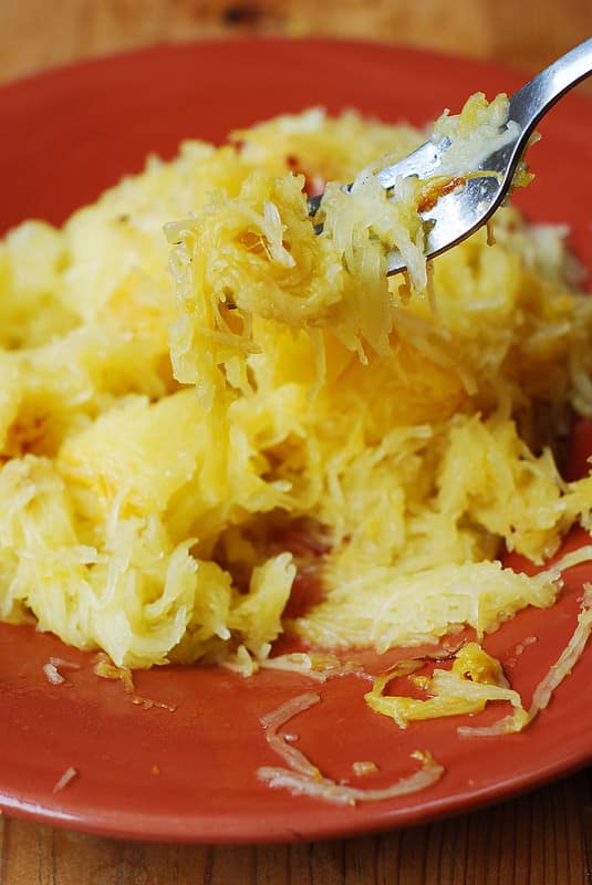 scraping flesh out of spaghetti squash and cooling it