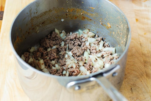Cooking beef, onions, and garlic for the chili (process shot)