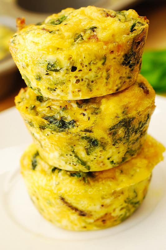 breakfast egg muffins with bacon and spinach and parmesan cheese