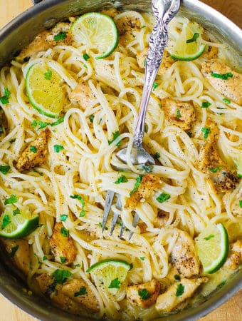 Creamy Cilantro-Lime Chicken Pasta in a stainless steel skillet