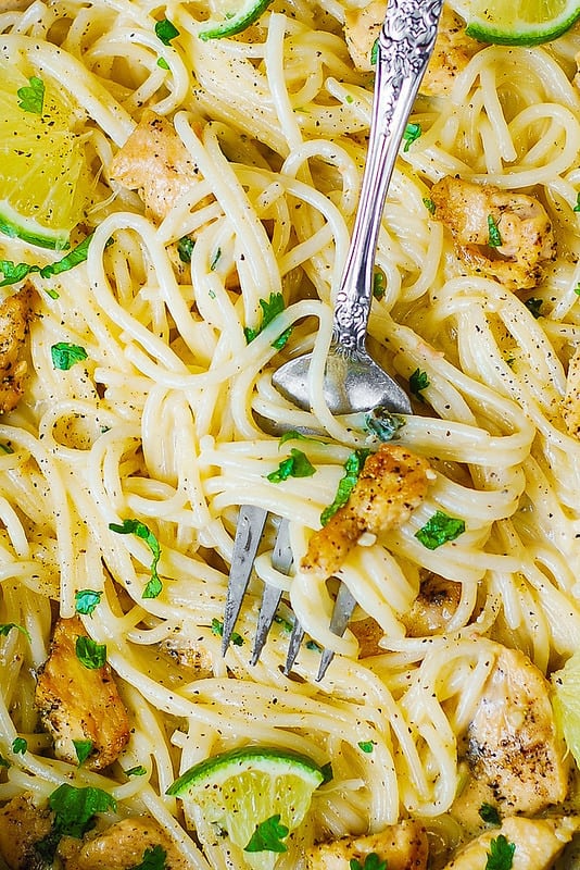 Creamy Cilantro-Lime Chicken Pasta (close-up photo of pasta with the fork in the middle)
