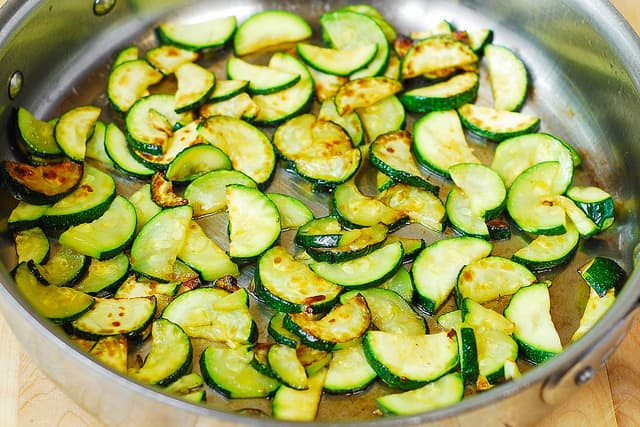 cooking zucchini in olive oil (process shot)