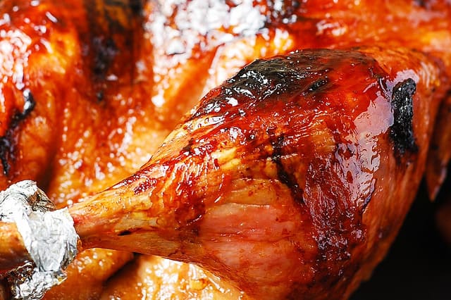 close-up of whole roast duck with honey-balsamic glaze