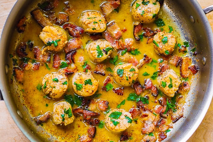 Bacon Scallops with Lemon Butter Sauce in a stainless steel skillet