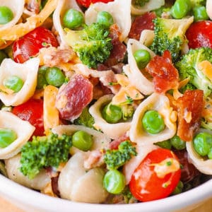 broccoli bacon ranch pasta salad with green peas, cherry or grape tomatoes