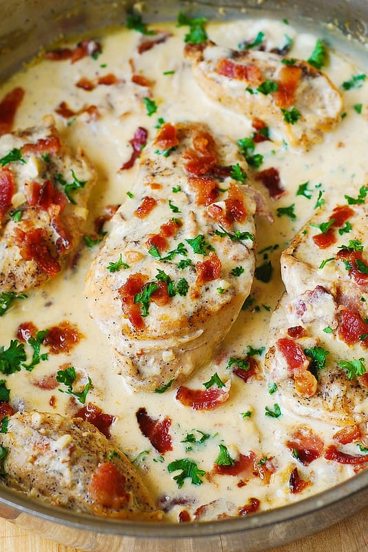 Asiago Chicken with Bacon Cream Sauce - in a stainless steel pan.