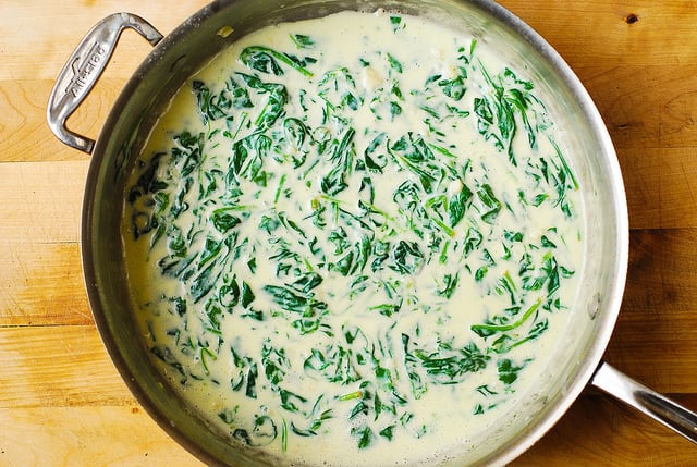 creamed spinach in a stainless steel pan