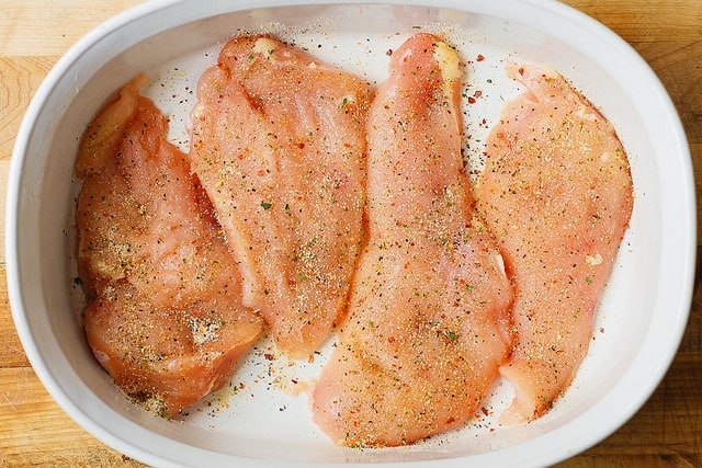 raw chicken breasts in a casserole dish