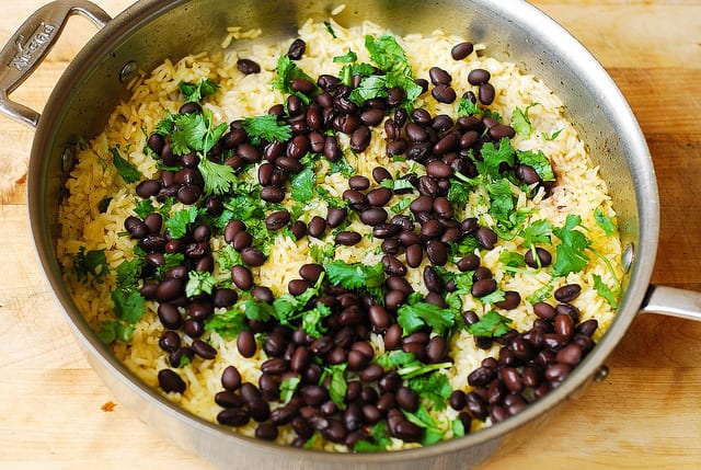 remove chicken from the skillet and add black beans, lime, cilantro, easy chicken dinner recipes, chicken thigh recipes, healthy chicken thigh recipes, healthy rice, gluten free dinners