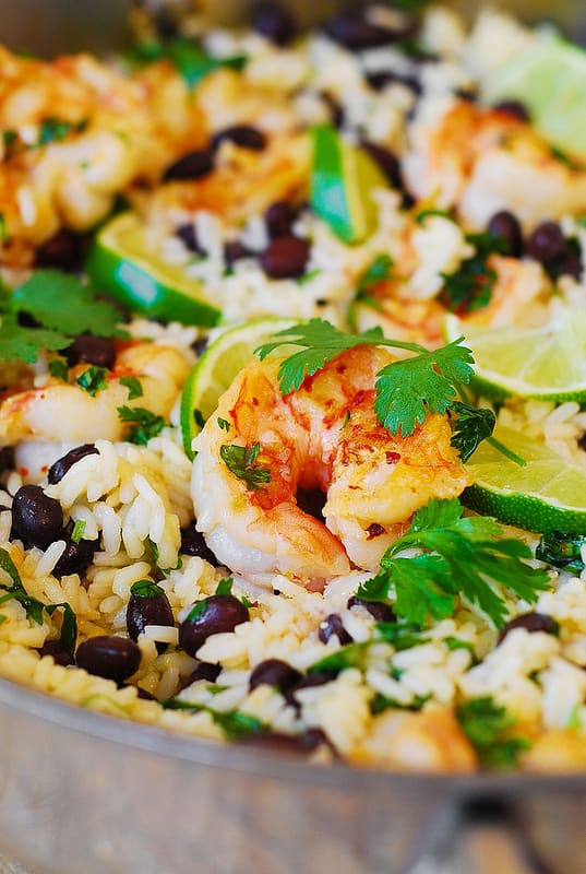 Black bean and cilantro-lime shrimp with rice in a stainless steel skillet