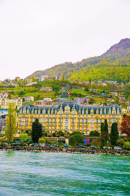 view of a beautiful yellow building with blue roof in Montreux, Switzerland