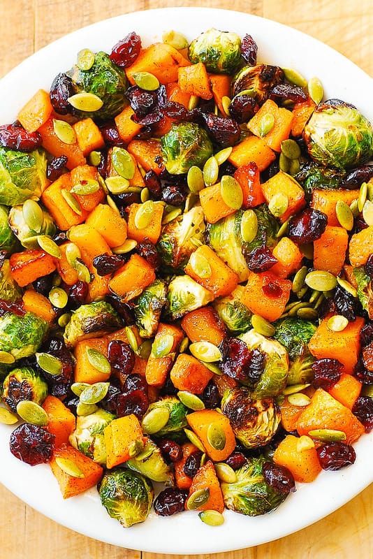 Thanksgiving salad with Roasted Brussels Sprouts, Maple Butternut Squash, Pumpkin Seeds, and Cranberries