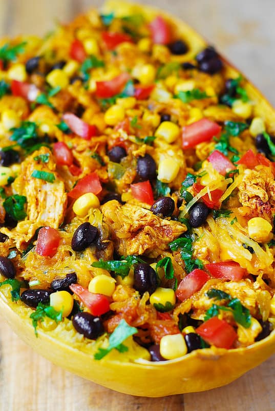 Southwestern Chicken Stuffed Butternut Squash with black beans, bell pepper, tomatoes, corn, green chilies, cheddar cheese, cilantro 