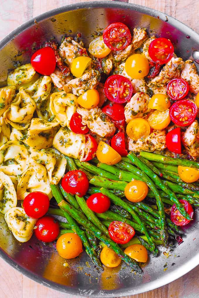 pesto chicken tortellini with asparagus and cherry tomatoes