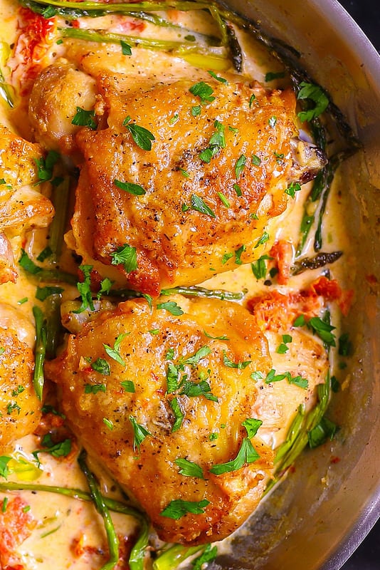 chicken thighs cooked in a skillet, stove-top chicken thighs, easy chicken thighs, best chicken thighs, best dinner recipes