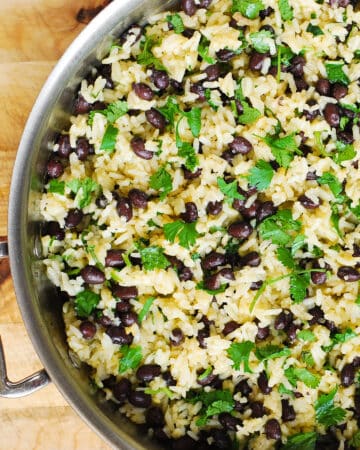 cilantro lime black bean rice - in a stainless steel skillet.