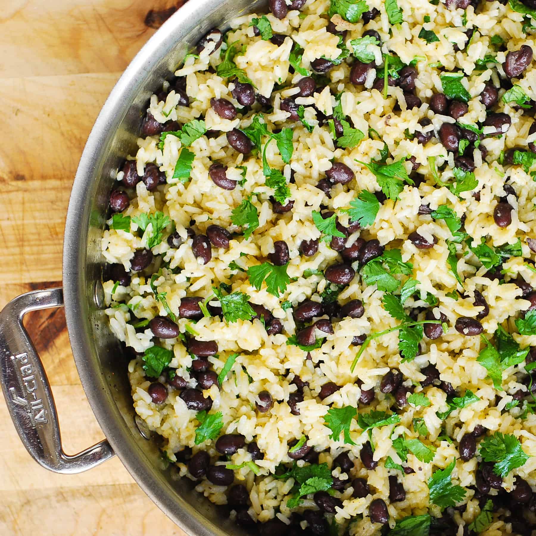 cilantro lime black bean rice - in a stainless steel skillet.