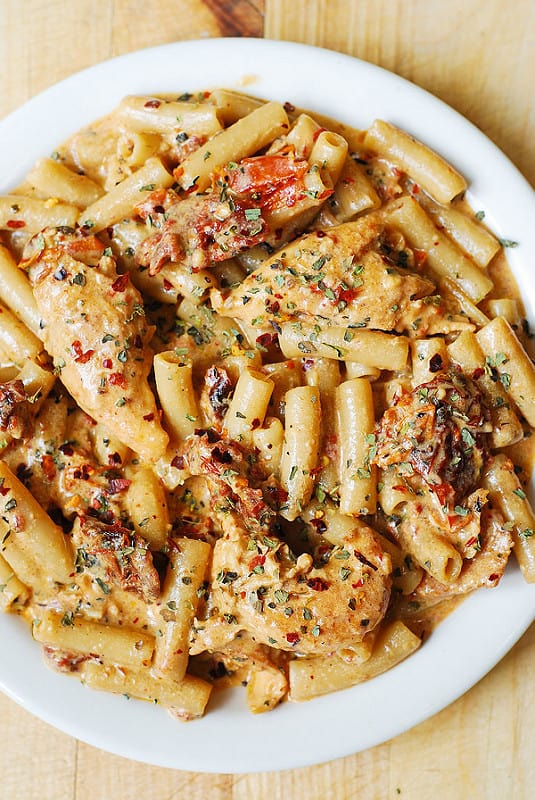 Sun-Dried Tomato Pasta with Chicken on a white plate