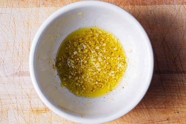 garlic and olive oil sauce in a white bowl