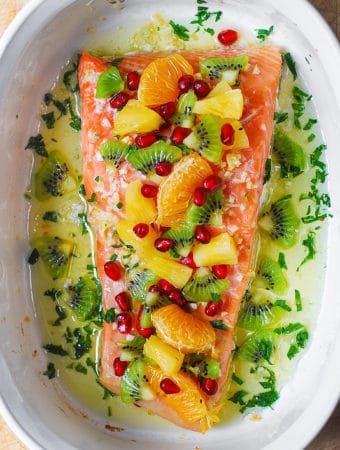 Garlic Lime Salmon with Honey-Lime Pineapple Salsa - in a white casserole dish.